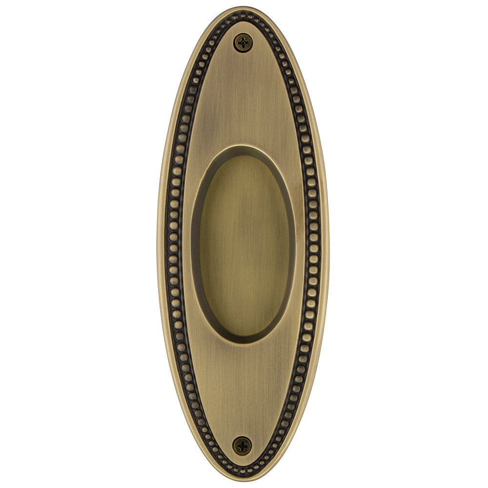 Nostalgic Warehouse 701401: 6-3/4" Oval Beaded Flush Door Pull - Antique Brass