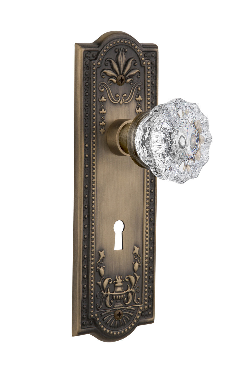 Nostalgic 701825: Meadows Backplate w/Clear Crystal Glass Knob Privacy Door Set - Antique Brass