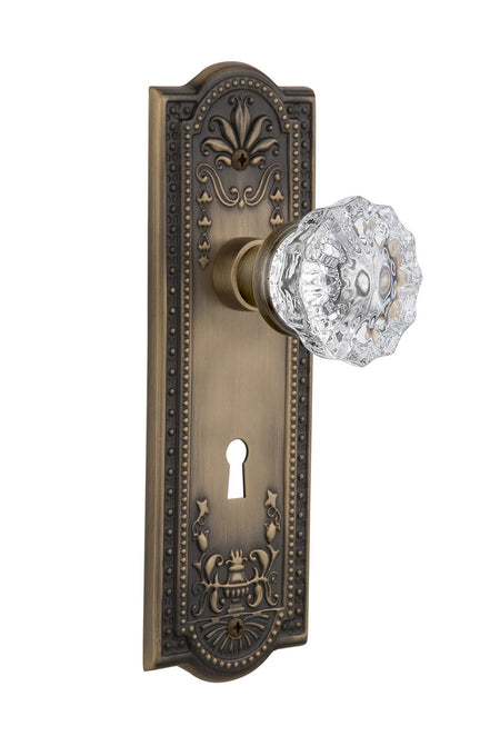 Nostalgic 701828: Meadows Backplate w/Clear Crystal Glass Knob Passage Door Set - Antique Brass