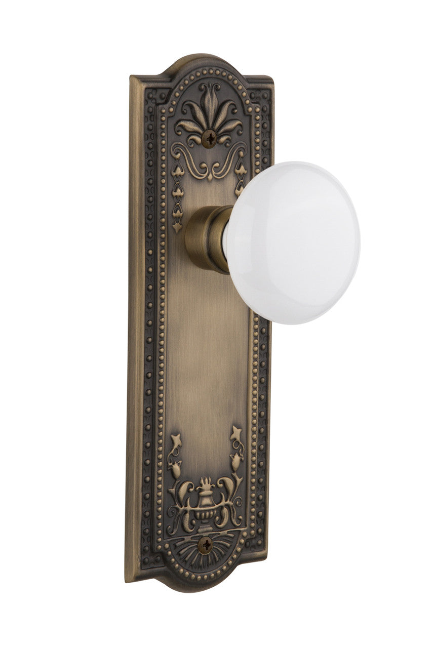 Nostalgic 701887: Meadows Backplate w/White Porcelain Knob Privacy Door Set - Antique Brass