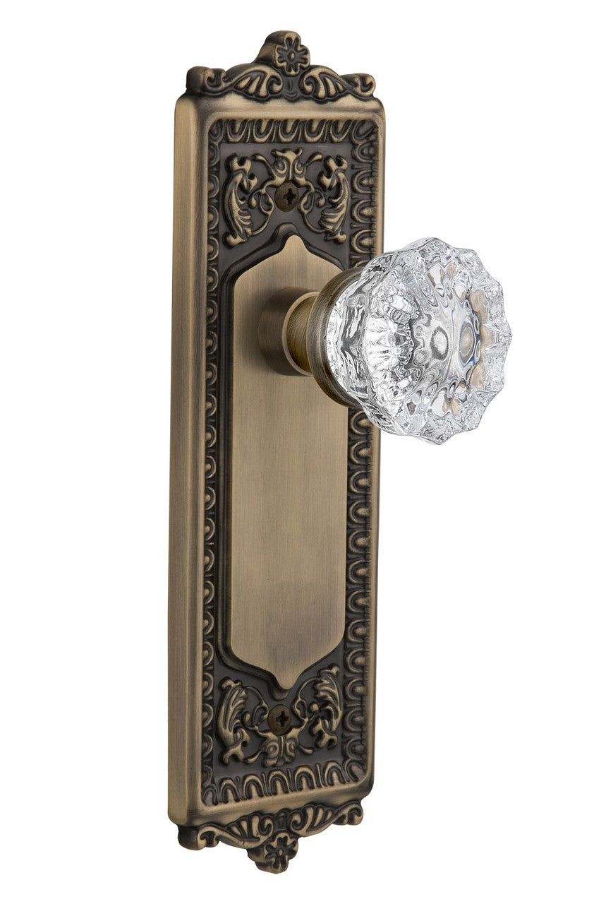 Nostalgic 701936: Egg & Dart Backplate w/Clear Crystal Glass Knob Single Dummy Door Set - Antique Brass