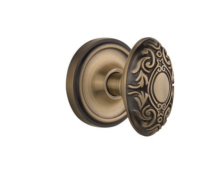 Nostalgic 702038: Classic Rosette w/Victorian Knob Passage Door Set - Antique Brass