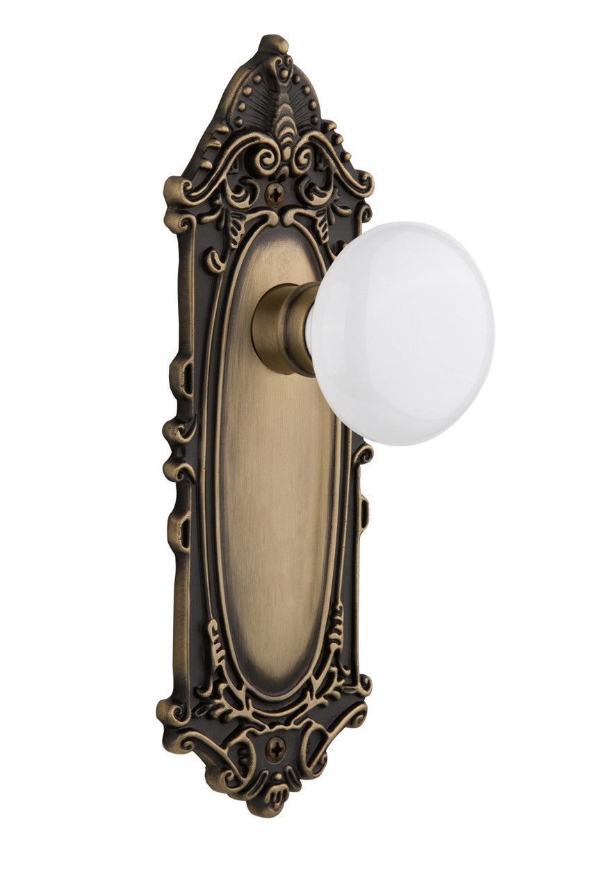 Nostalgic 702074: Victorian Backplate w/White Porcelain Knob Passage Door Set - Antique Brass