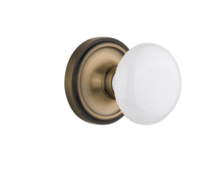 Nostalgic 702189: Classic Rosette w/White Porcelain Knob Single Dummy Door Set - Antique Brass