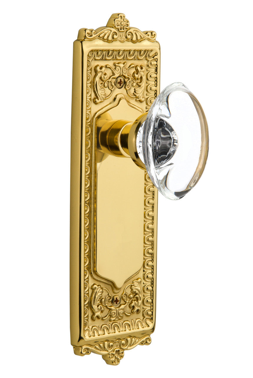 Nostalgic 702861: Egg & Dart Backplate w/Oval Clear Glass Crystal Knob Single Dummy Door Set - Unlacquered Brass