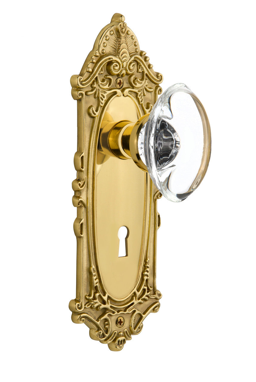 Nostalgic 702952: Victorian Backplate w/Oval Clear Glass Crystal Knob Single Dummy Door Set - Unlacquered Brass