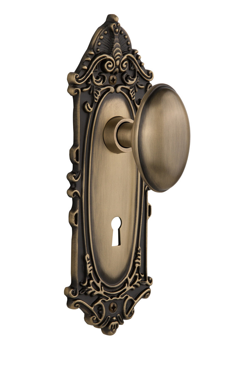 Nostalgic 704046: Victorian Backplate w/Homestead Knob Single Dummy Door Set - Antique Brass