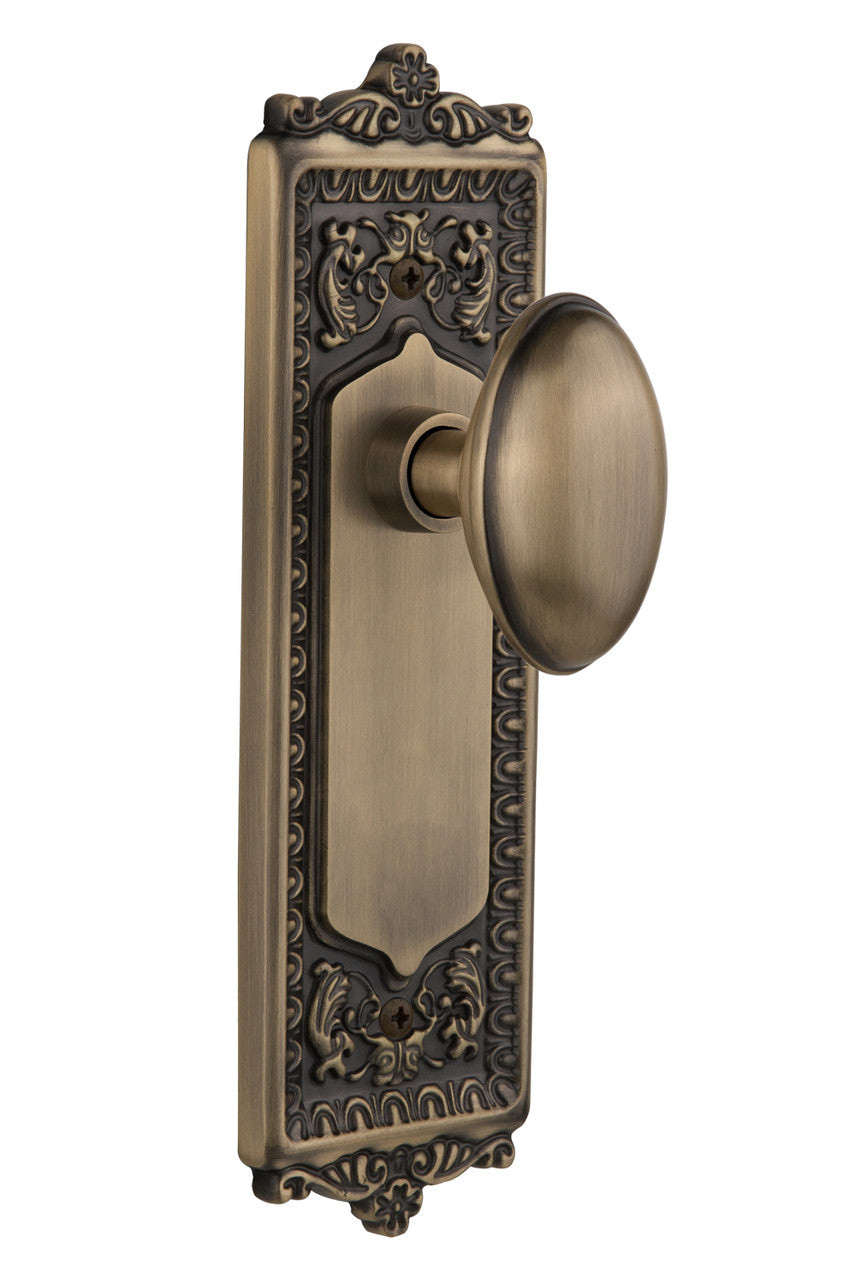 Nostalgic 704180: Egg & Dart Backplate w/Homestead Knob Privacy Door Set - Antique Brass