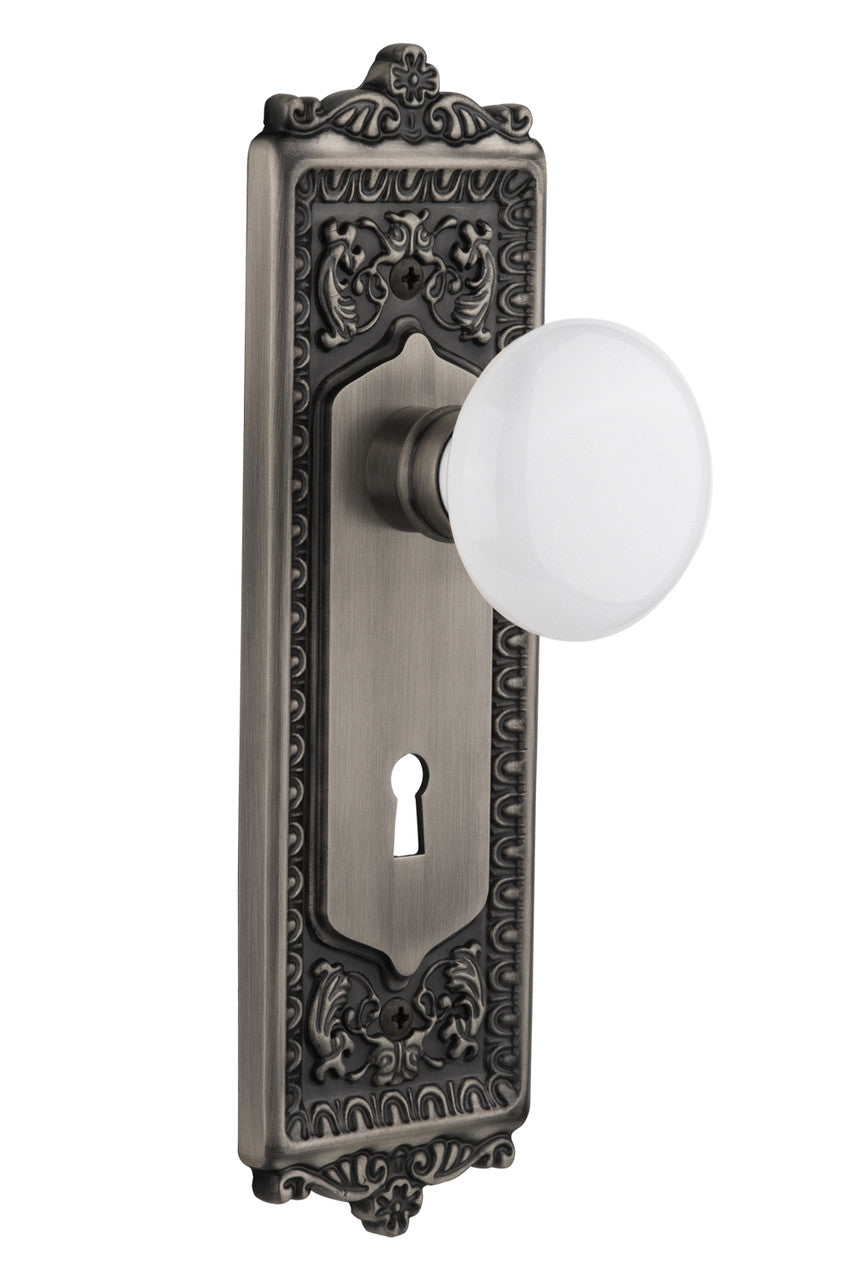 Nostalgic 704282: Egg & Dart Backplate w/White Porcelain Knob Passage Door Set - Antique Pewter