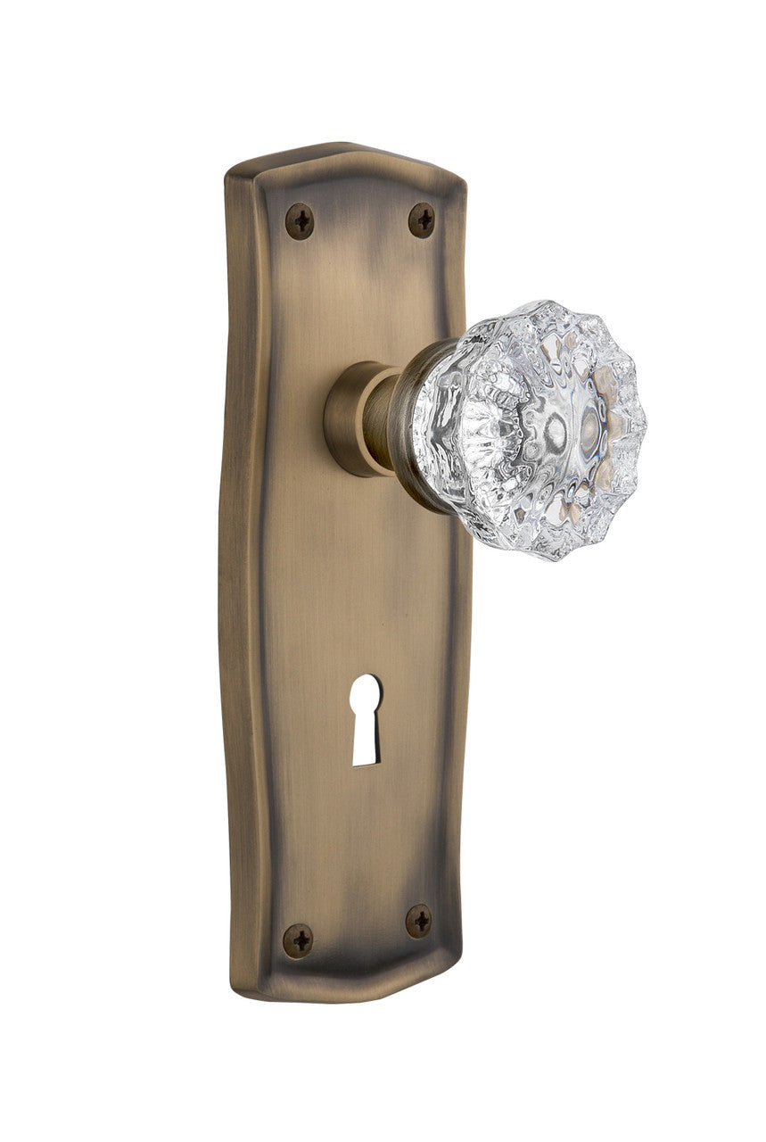 Nostalgic 704479: Prairie Backplate w/Clear Crystal Glass Knob Single Dummy Door Set - Antique Brass