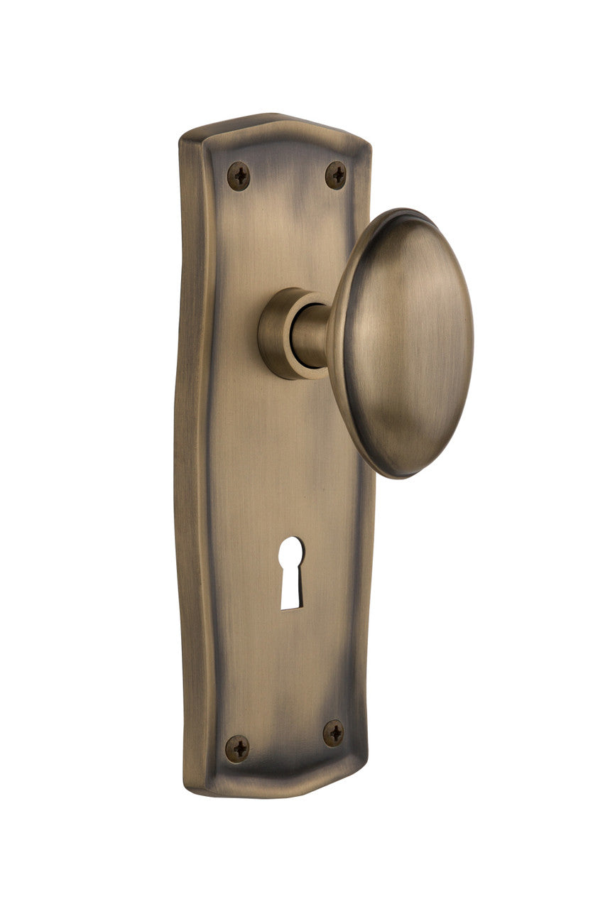 Nostalgic 704484: Prairie Backplate w/Homestead Knob Privacy Door Set - Antique Brass