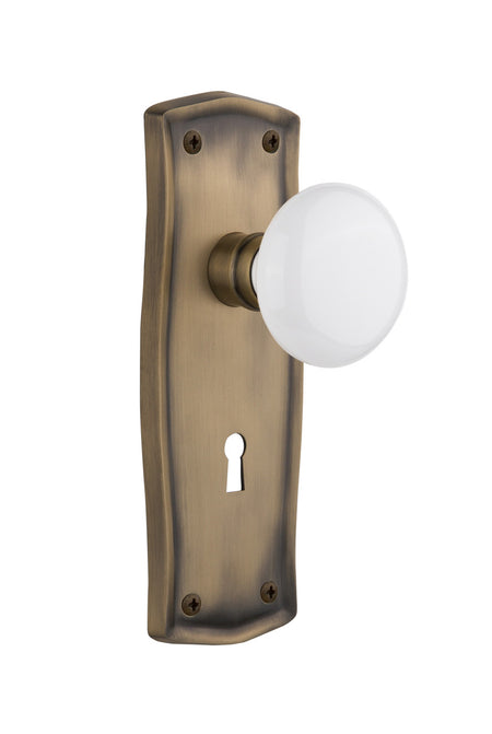 Nostalgic 704523: Prairie Backplate w/White Porcelain Knob Privacy Door Set - Antique Brass