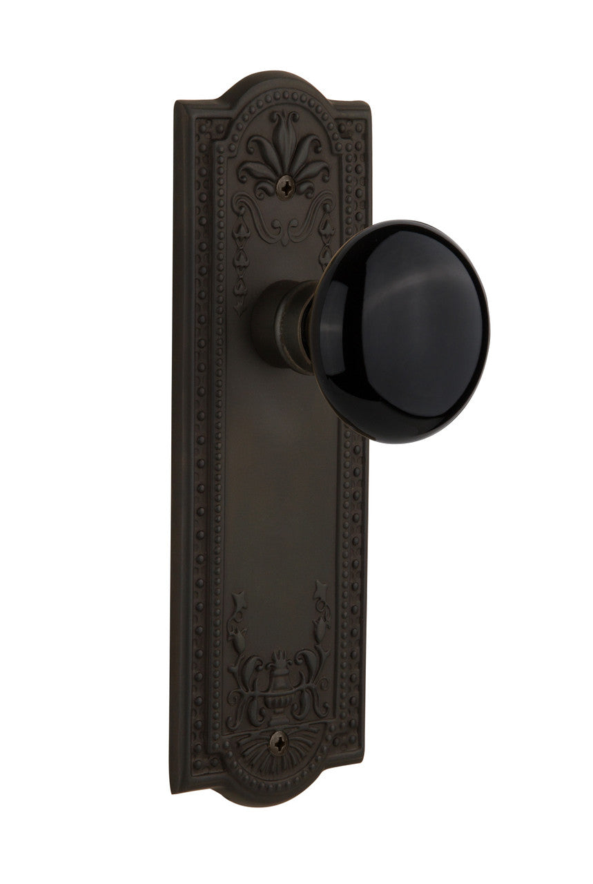Nostalgic 710017: Meadows Backplate w/Black Porcelain Knob Passage Door Set - Oil-Rubbed Bronze