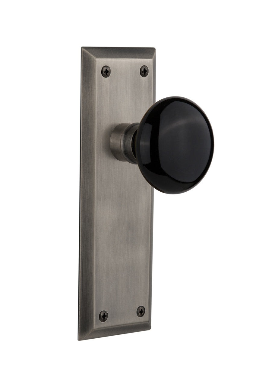 Nostalgic 710022: New York Backplate w/Black Porcelain Knob Passage Door Set - Antique Pewter