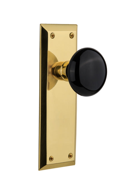 Nostalgic 710025: New York Backplate w/Black Porcelain Knob Passage Door Set - Polished Brass