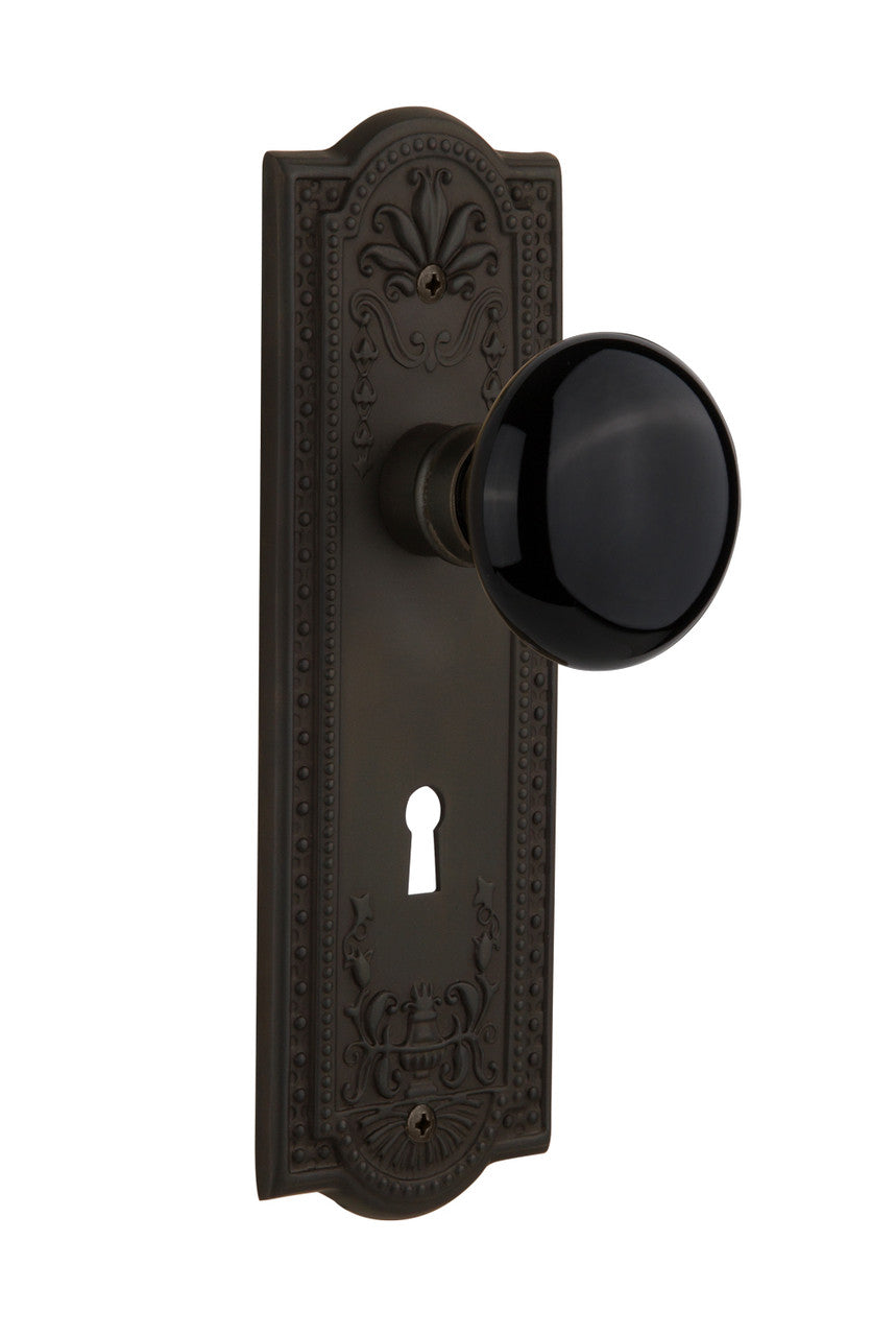 Nostalgic 710071: Meadows Backplate w/Black Porcelain Knob Passage Door Set - Oil-Rubbed Bronze