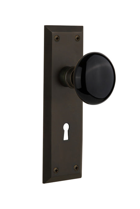 Nostalgic 710078: New York Backplate w/Black Porcelain Knob Passage Door Set - Oil-Rubbed Bronze