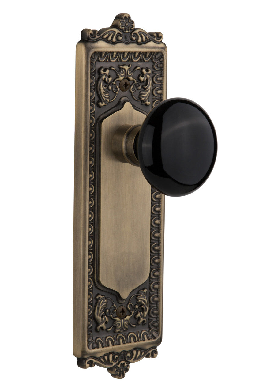 Nostalgic 710295: Egg & Dart Backplate w/Black Porcelain Knob Privacy Door Set - Antique Brass