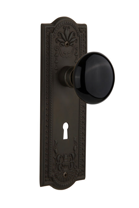 Nostalgic 710359: Meadows Backplate w/Black Porcelain Knob Privacy Door Set - Oil-Rubbed Bronze