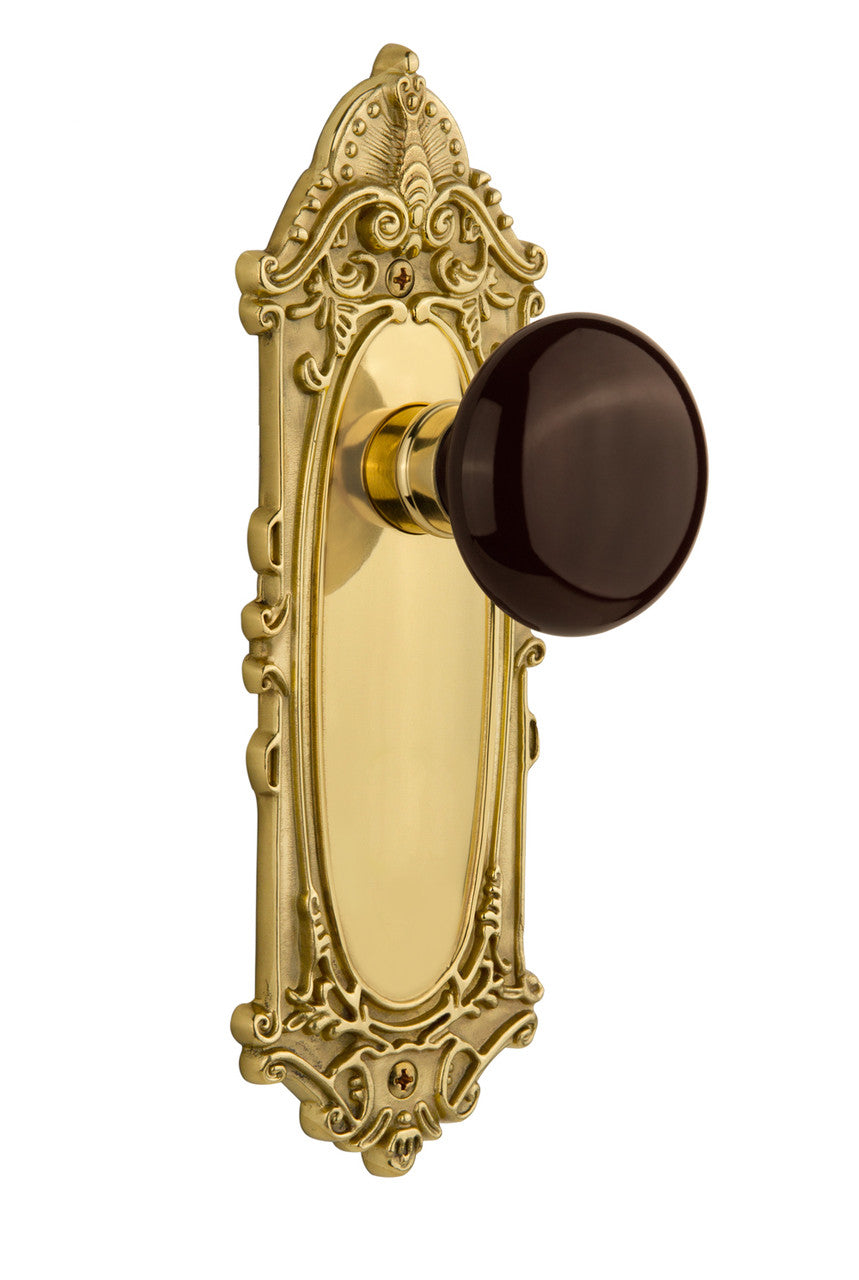 Nostalgic 710479: Victorian Backplate w/Brown Porcelain Knob Passage Door Set - Polished Brass