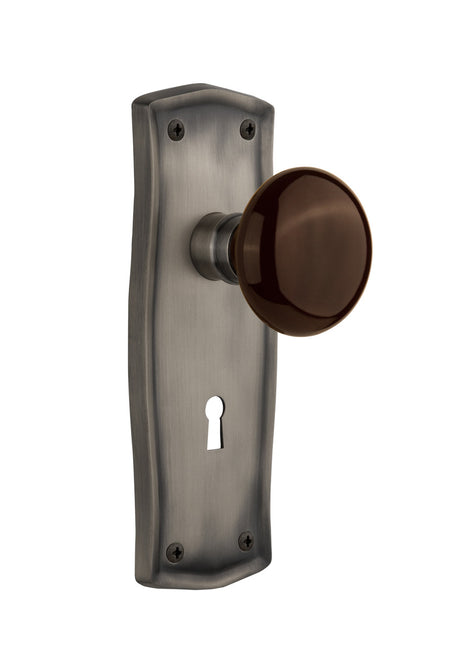 Nostalgic 710523: Prairie Backplate w/Brown Porcelain Knob Passage Door Set - Antique Pewter