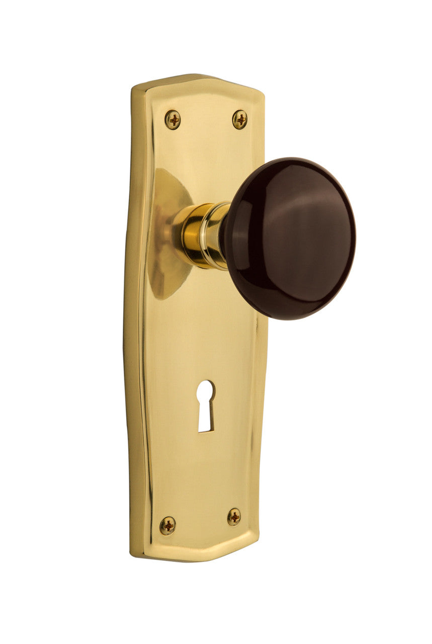 Nostalgic 710526: Prairie Backplate w/Brown Porcelain Knob Passage Door Set - Polished Brass
