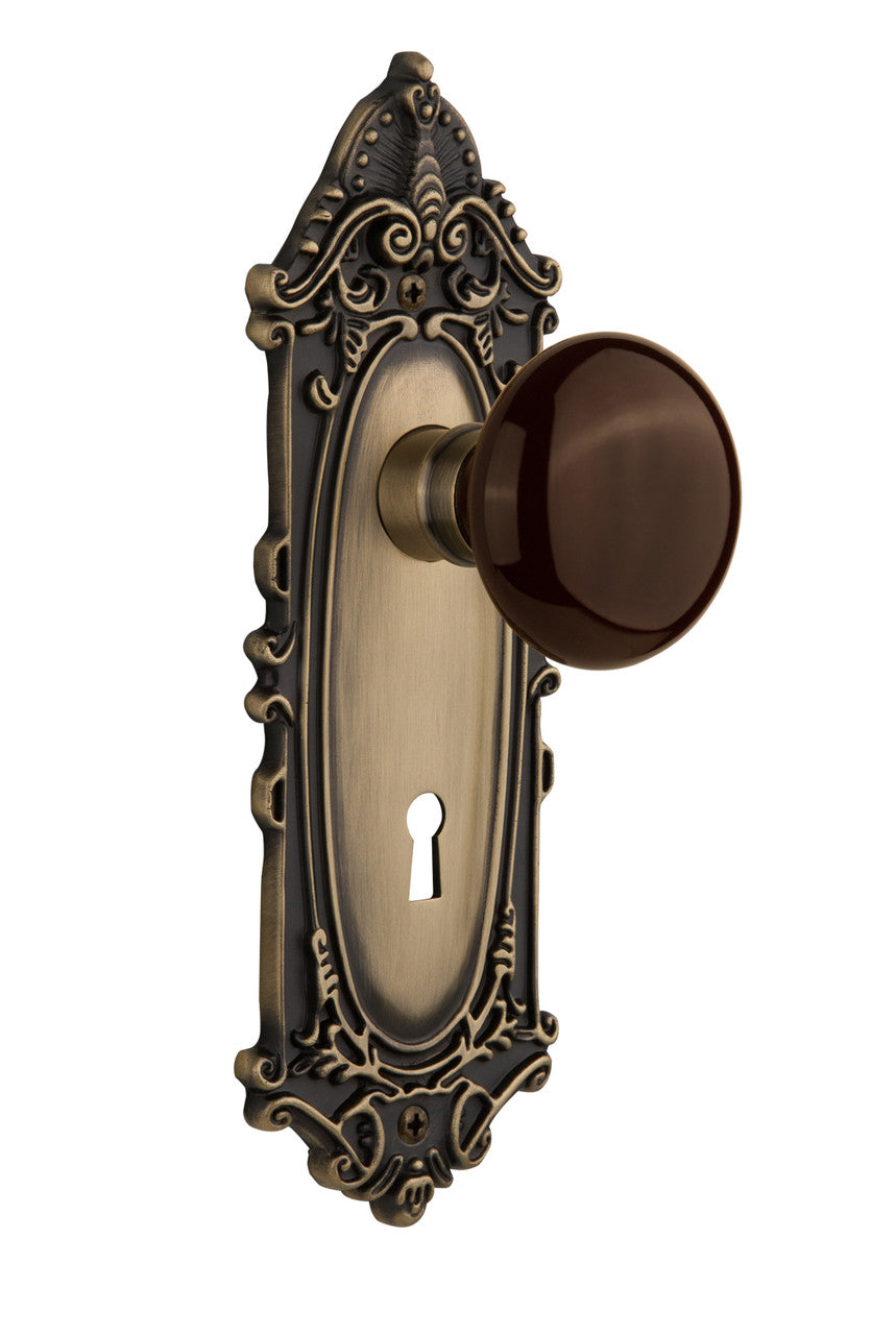 Nostalgic 710625: Victorian Backplate w/Brown Porcelain Knob Single Dummy Door Set - Antique Brass