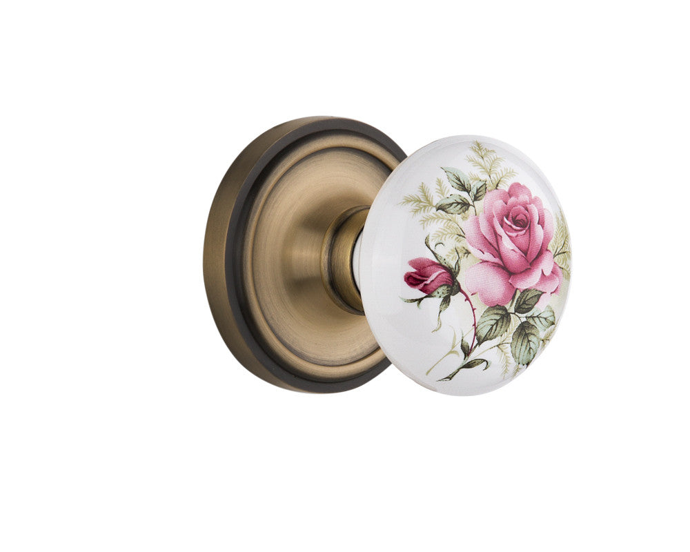 Nostalgic 710976: Classic Rosette w/White Rose Porcelain Knob Single Dummy Door Set - Antique Brass