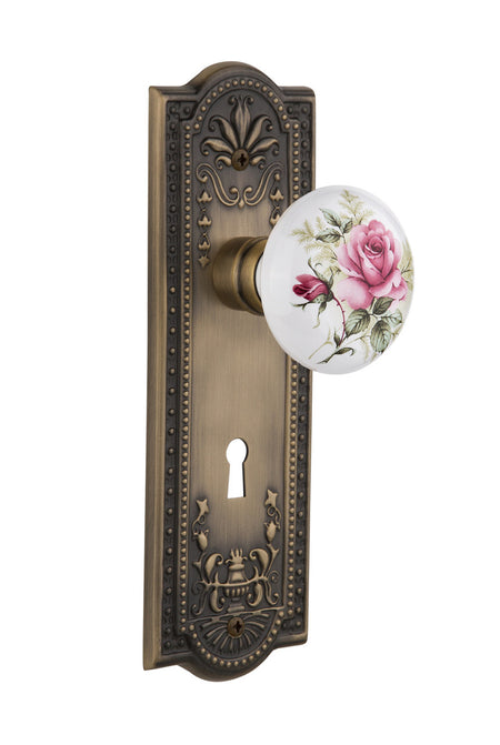 Nostalgic 711044: Meadows Backplate w/White Rose Porcelain Knob Single Dummy Door Set - Antique Brass