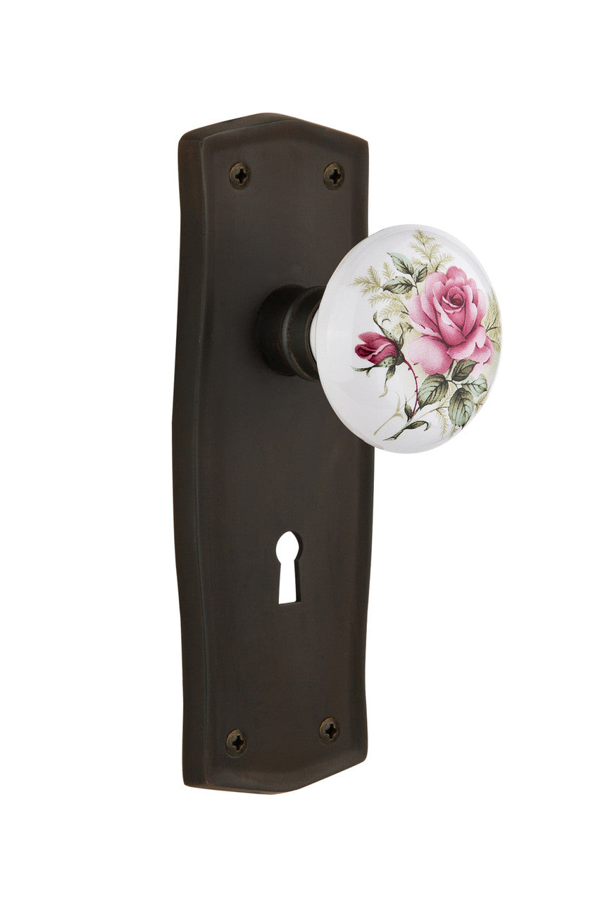 Nostalgic 711061: Prairie Backplate w/White Rose Porcelain Knob Single Dummy Door Set - Oil-Rubbed Bronze
