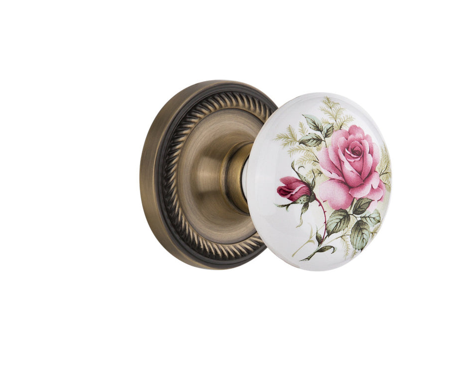 Nostalgic 711196: Rope Rosette w/White Rose Porcelain Knob Privacy Door Set - Antique Brass