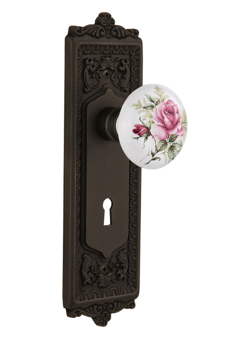 Nostalgic 711232: Egg & Dart Backplate w/White Rose Porcelain Knob Privacy Door Set - Oil-Rubbed Bronze