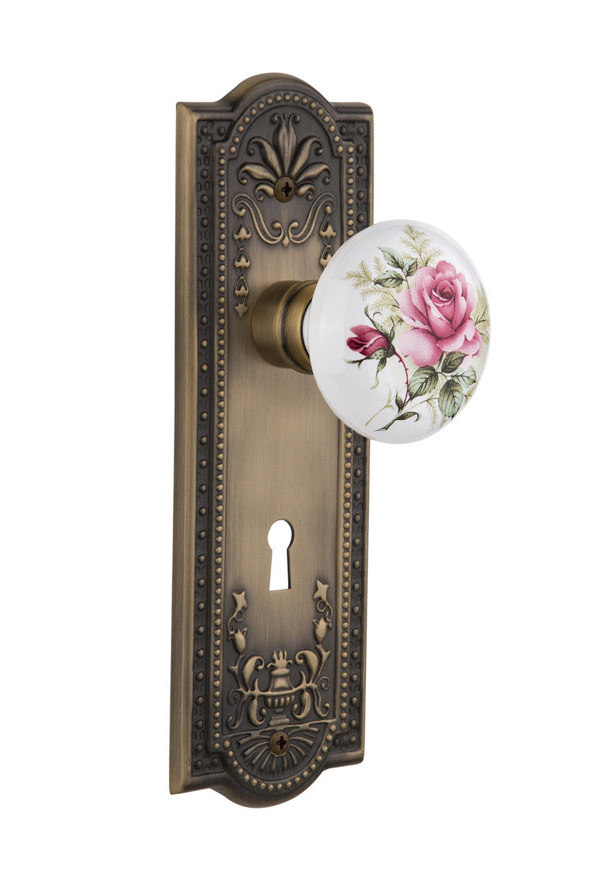Nostalgic 711236: Meadows Backplate w/White Rose Porcelain Knob Privacy Door Set - Antique Brass