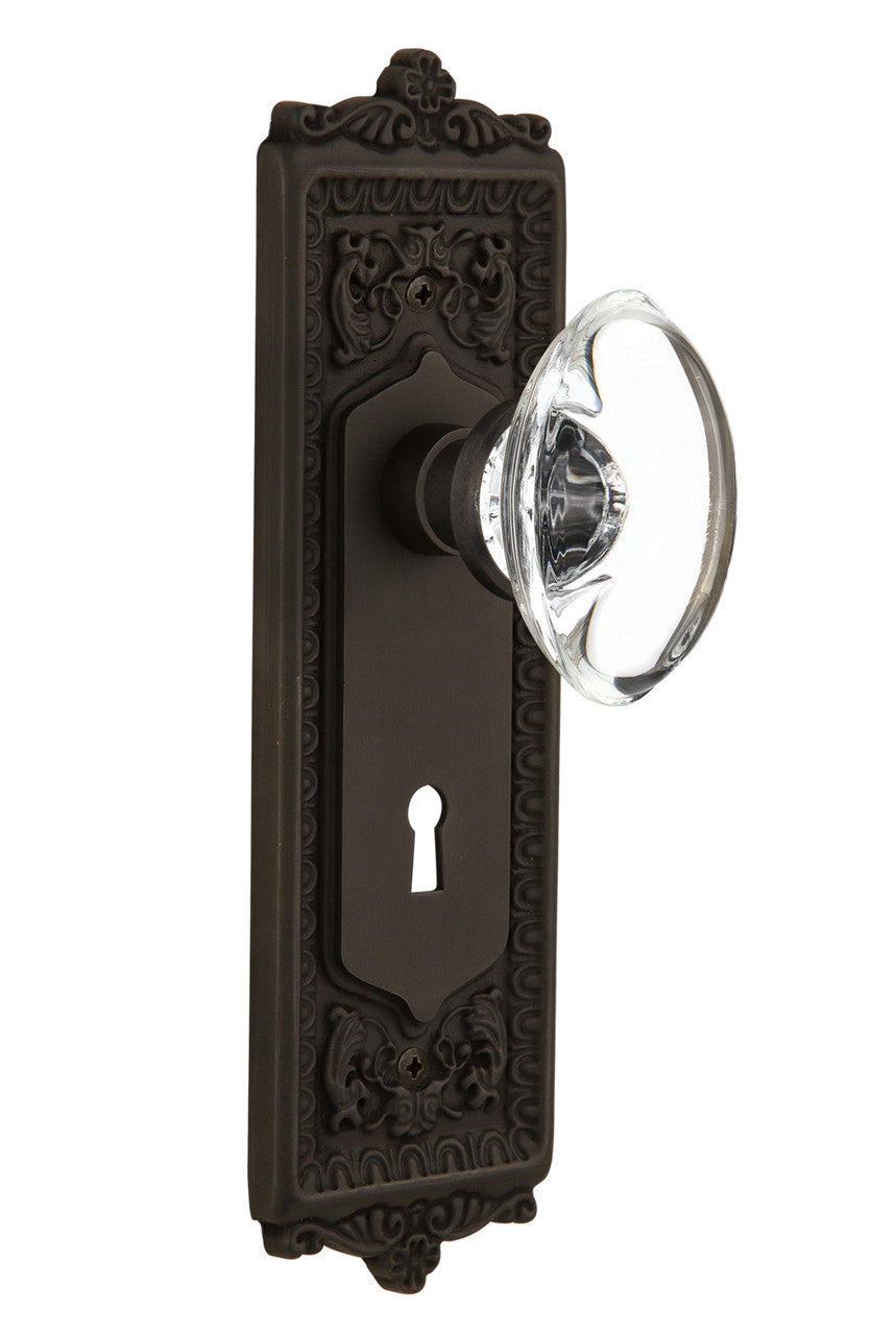 Nostalgic 711384: Egg & Dart Backplate w/Oval Clear Glass Crystal Knob Passage Door Set - Oil-Rubbed Bronze