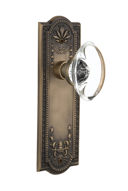 Nostalgic 711430: Meadows Backplate w/Oval Clear Glass Crystal Knob Single Dummy Door Set - Antique Brass