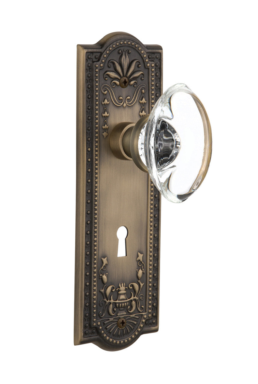 Nostalgic 711484: Meadows Backplate w/Oval Clear Glass Crystal Knob Single Dummy Door Set - Antique Brass