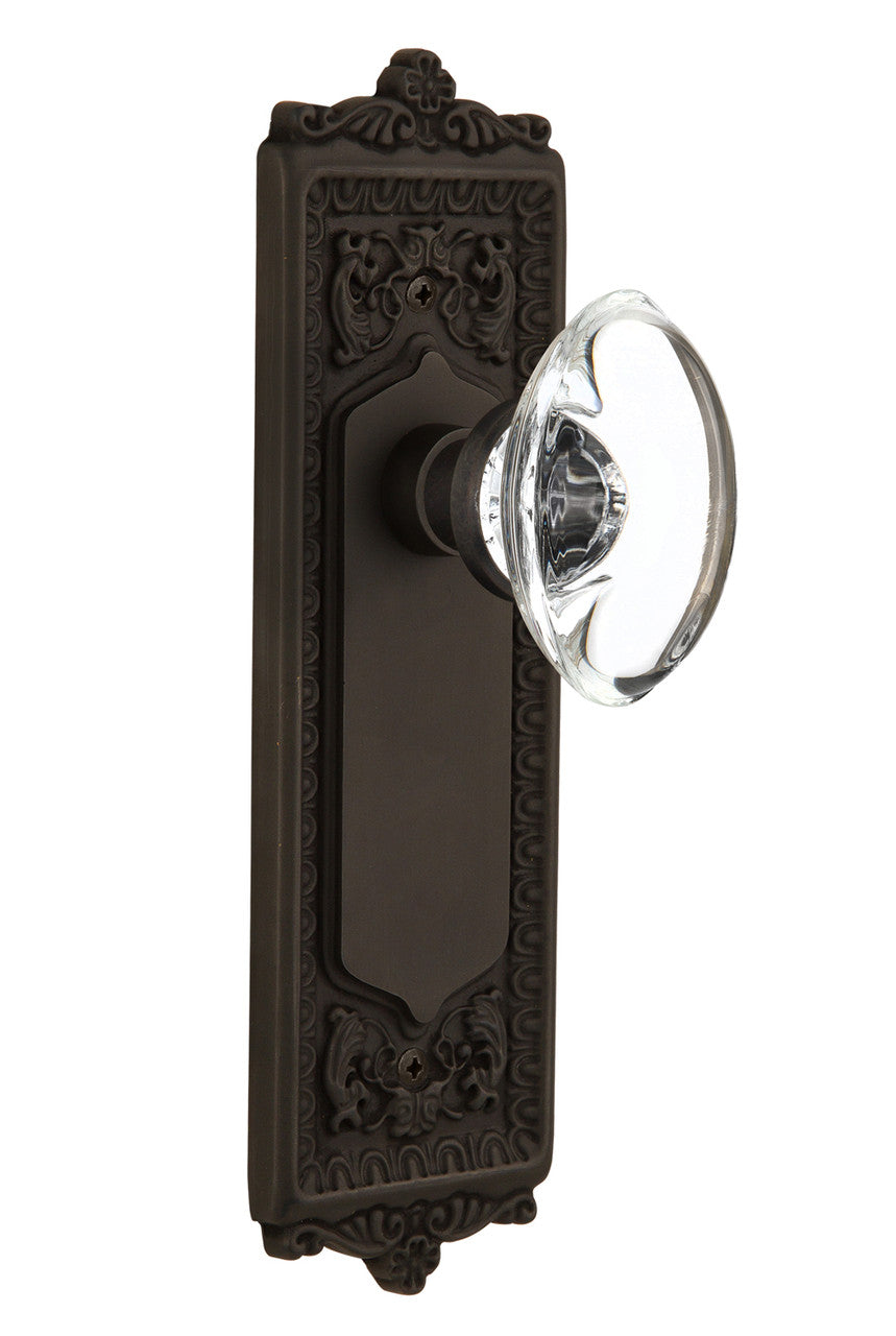 Nostalgic 711618: Egg & Dart Backplate w/Oval Clear Glass Crystal Knob Privacy Door Set - Oil-Rubbed Bronze