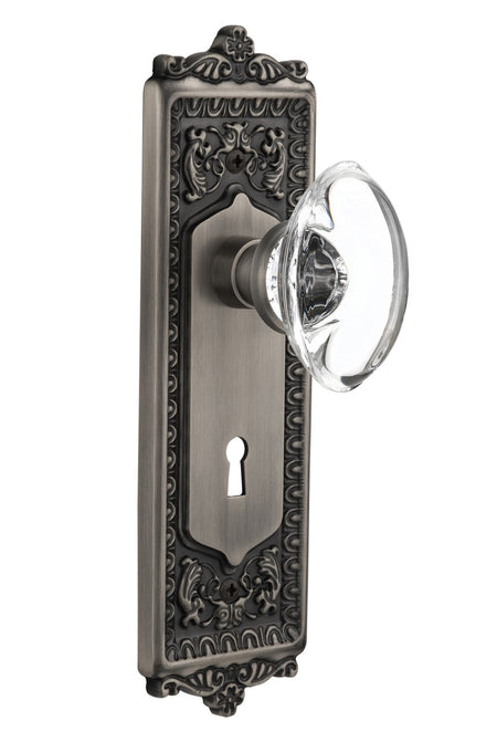 Nostalgic 711670: Egg & Dart Backplate w/Oval Clear Glass Crystal Knob Privacy Door Set - Antique Pewter