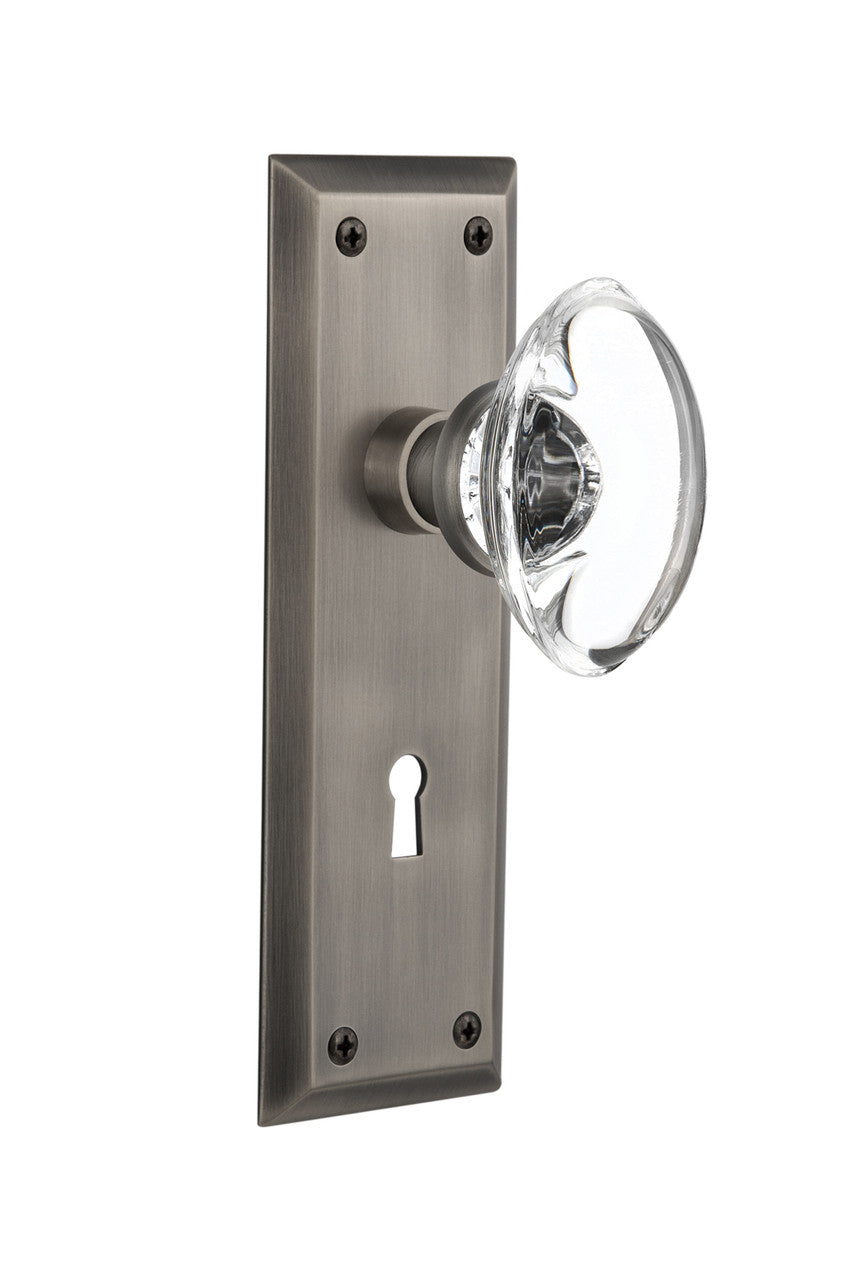 Nostalgic 711684: New York Backplate w/Oval Clear Glass Crystal Knob Privacy Door Set - Antique Pewter