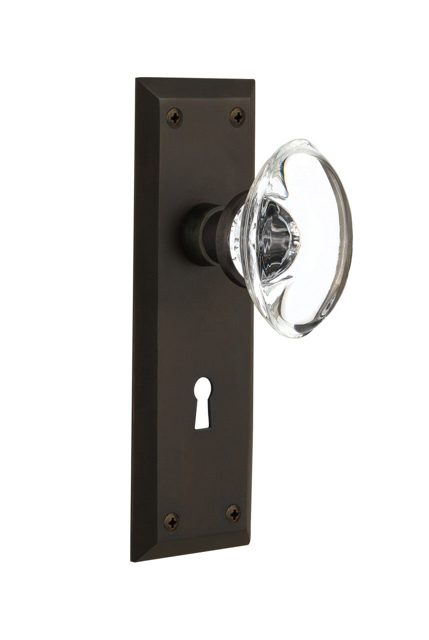 Nostalgic 711686: New York Backplate w/Oval Clear Glass Crystal Knob Privacy Door Set - Oil-Rubbed Bronze