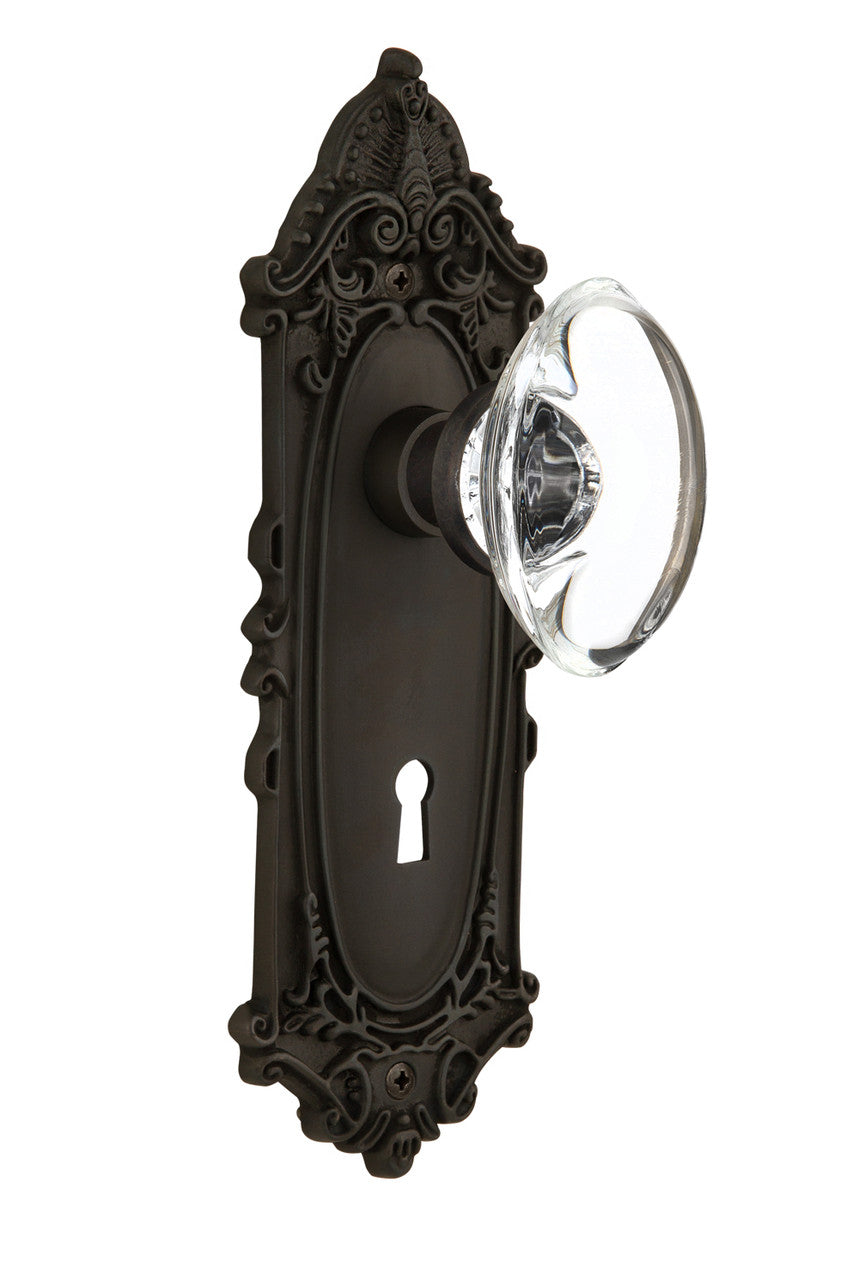 Nostalgic 711700: Victorian Backplate w/Oval Clear Glass Crystal Knob Privacy Door Set - Oil-Rubbed Bronze