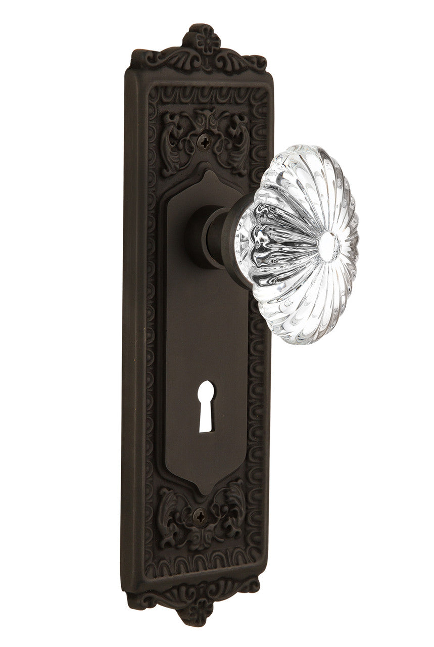 Nostalgic 711824: Egg & Dart Backplate w/Oval Fluted Clear Glass Crystal Knob Passage Door Set - Oil-Rubbed Bronze