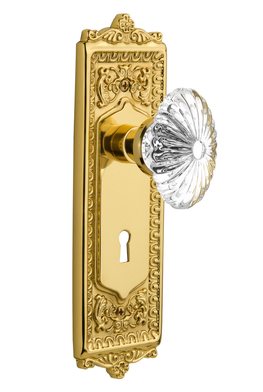 Nostalgic 711825: Egg & Dart Backplate w/Oval Fluted Clear Glass Crystal Knob Passage Door Set - Polished Brass