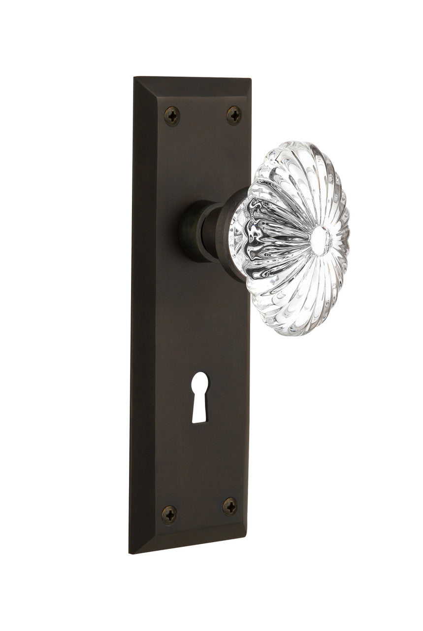 Nostalgic 711838: New York Backplate w/Oval Fluted Clear Glass Crystal Knob Passage Door Set - Oil-Rubbed Bronze