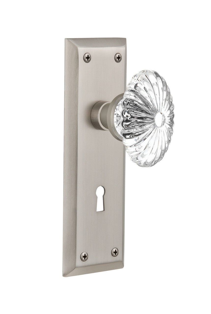 Nostalgic 711840: New York Backplate w/Oval Fluted Clear Glass Crystal Knob Passage Door Set - Satin Nickel