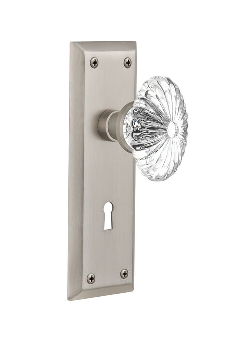 Nostalgic 711840: New York Backplate w/Oval Fluted Clear Glass Crystal Knob Passage Door Set - Satin Nickel