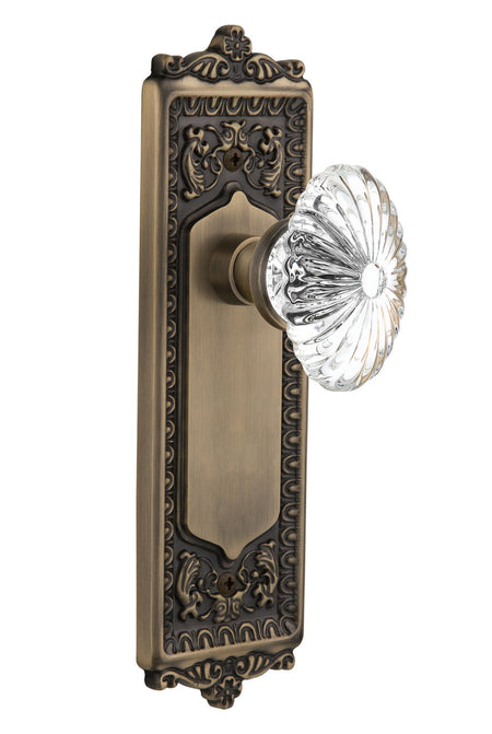 Nostalgic 711863: Egg & Dart Backplate w/Oval Fluted Clear Glass Crystal Knob Single Dummy Door Set - Antique Brass
