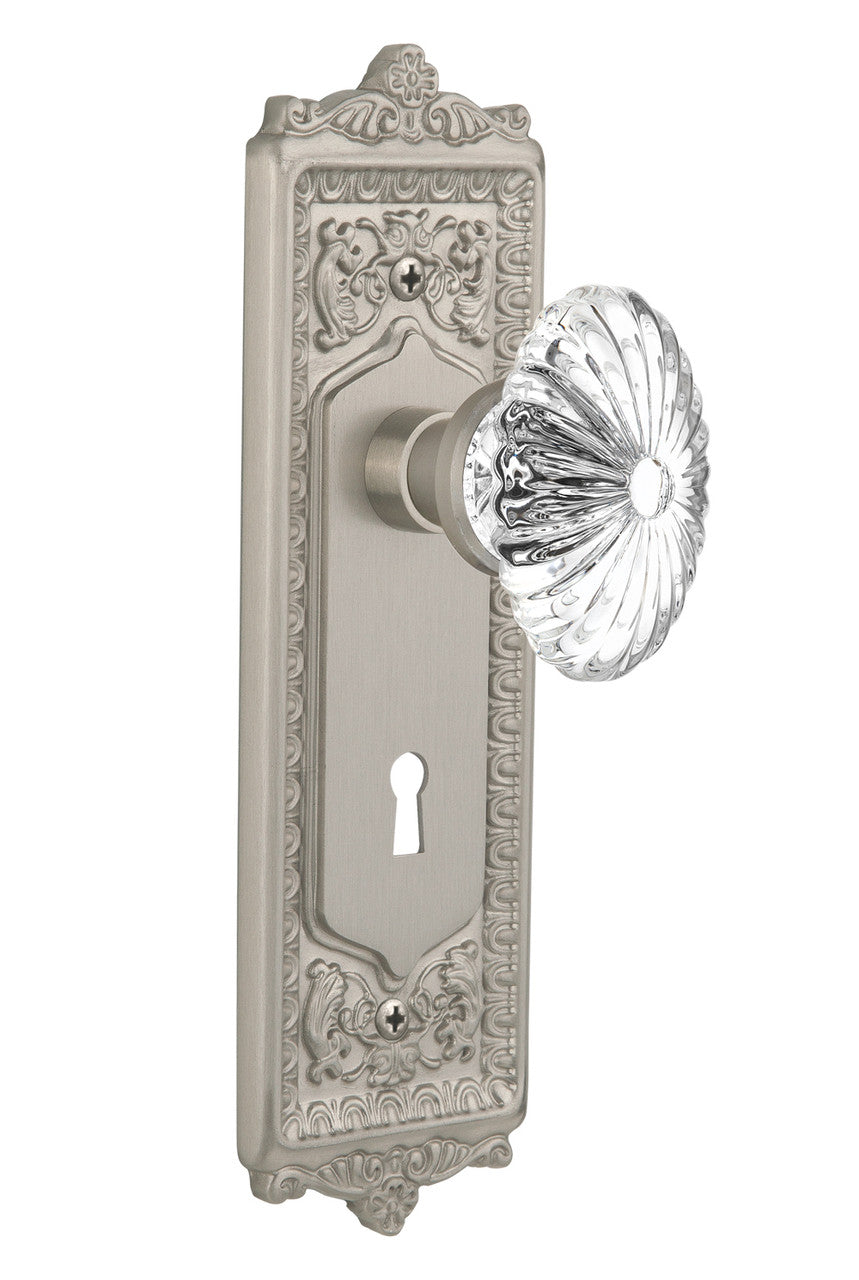Nostalgic 711922: Egg & Dart Backplate w/Oval Fluted Clear Glass Crystal Knob Single Dummy Door Set - Satin Nickel