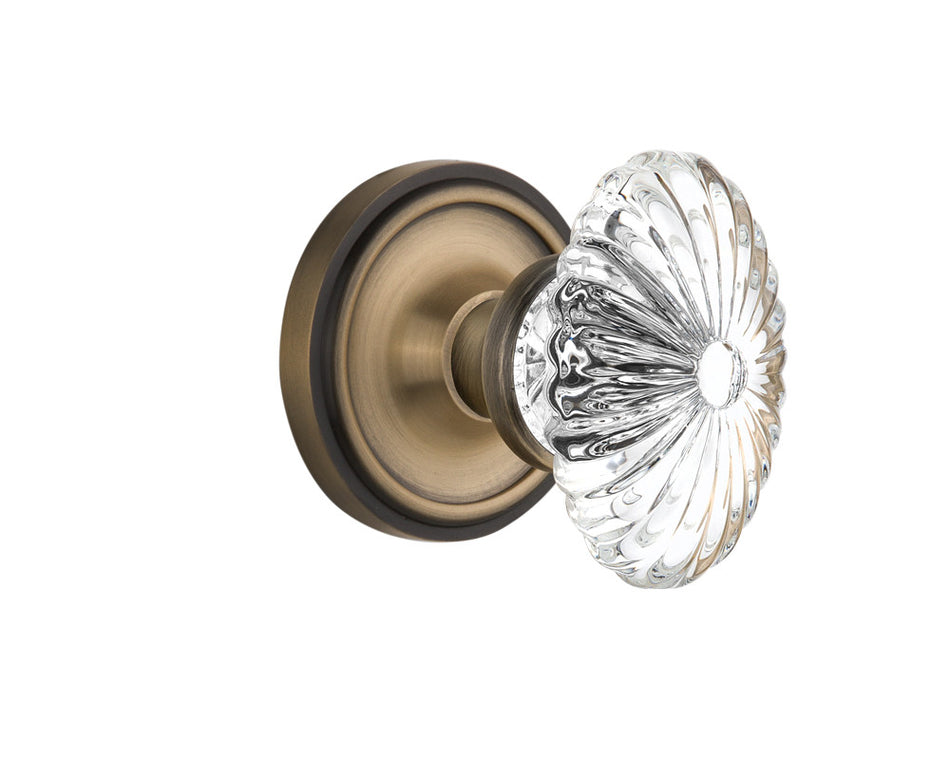 Nostalgic 712048: Classic Rosette w/Oval Fluted Clear Glass Crystal Knob Privacy Door Set - Antique Brass