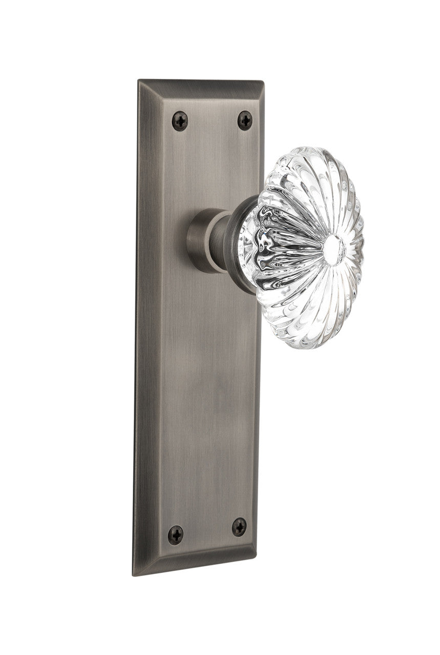 Nostalgic 712070: New York Backplate w/Oval Fluted Clear Glass Crystal Knob Privacy Door Set - Antique Pewter